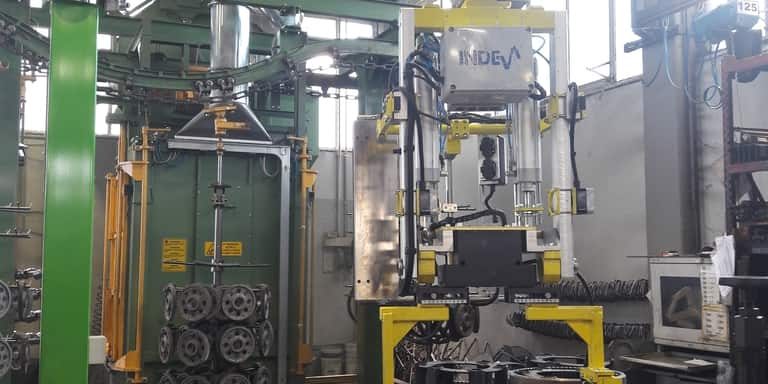 picture showing the application of an industrial manipulator with custom end effector for handling spur gears