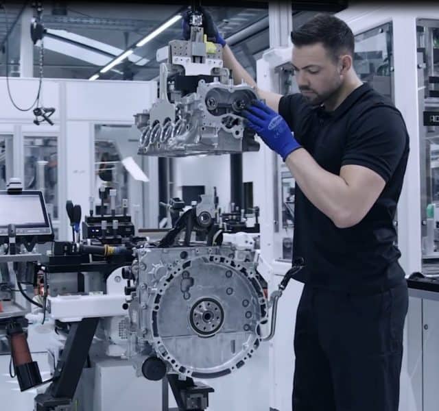 An INDEVA industrial man ipulator allows for very precise positioning of the engine in a car factory